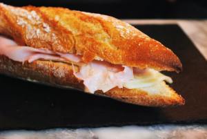 A grilled ham and cheese sandwich on French bread