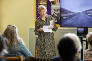 A story being read to the audience by one of the group members 