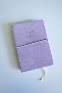 The Book Journal, showing the ribbon page marker, fastened together by the lilac elastic