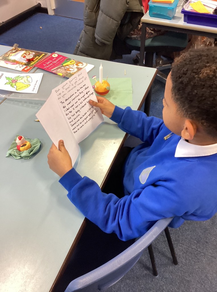 A boy reading one of the memories written in a card 