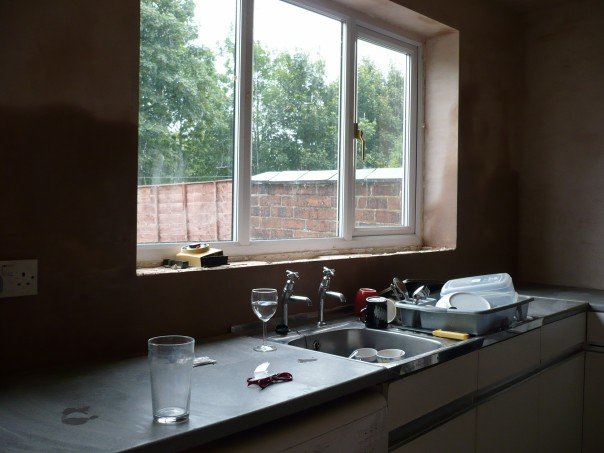 Another view of the work in progress, the sink and old kitchen cupboards are still there, and the plaster round the window is still drying.  